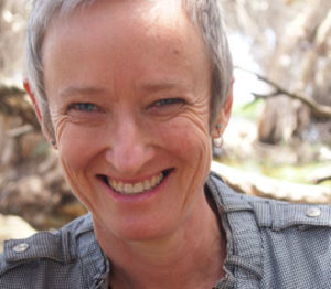 Image of author headshot Nandi Chinna close up smiling 
