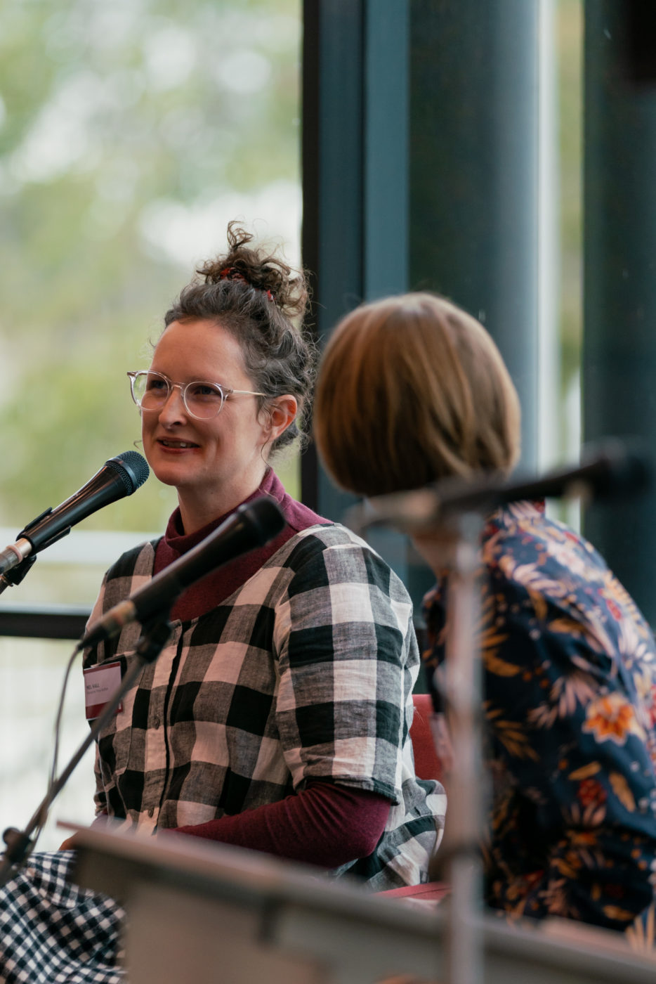 Image of woman speaking into microphone