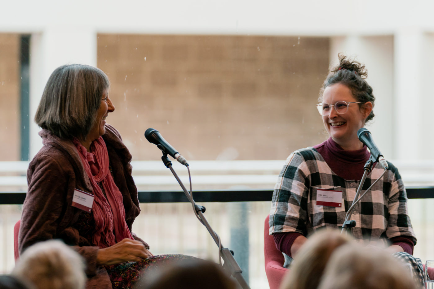 Image of two women smiling at each other