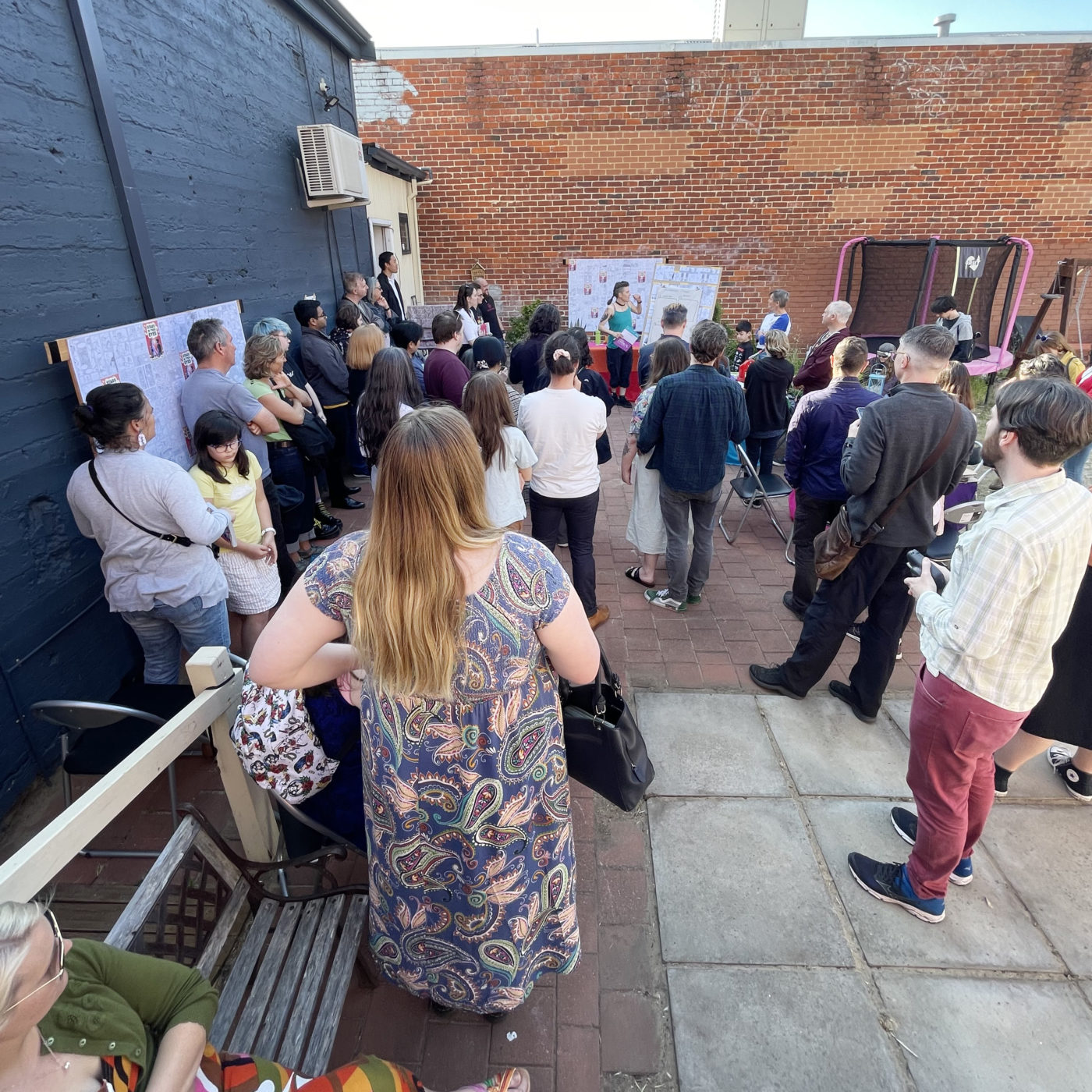 Image of a crowd of people outside of a building