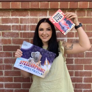 Jess Checkland holding up Stellarphant and Stars in their Eyes