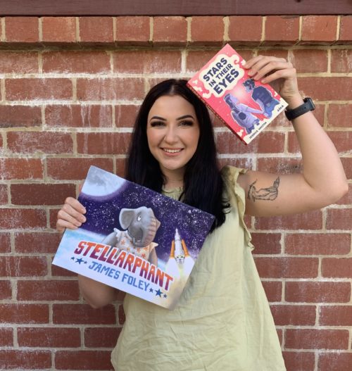 Jess Checkland holding up Stellarphant and Stars in their Eyes